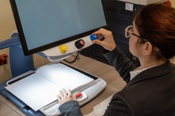 A visually impaired woman uses a screen reader