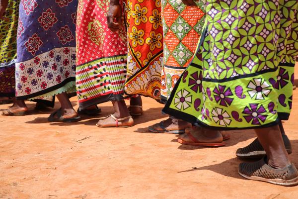 Image of Kenyan women's feet and colourful dresses