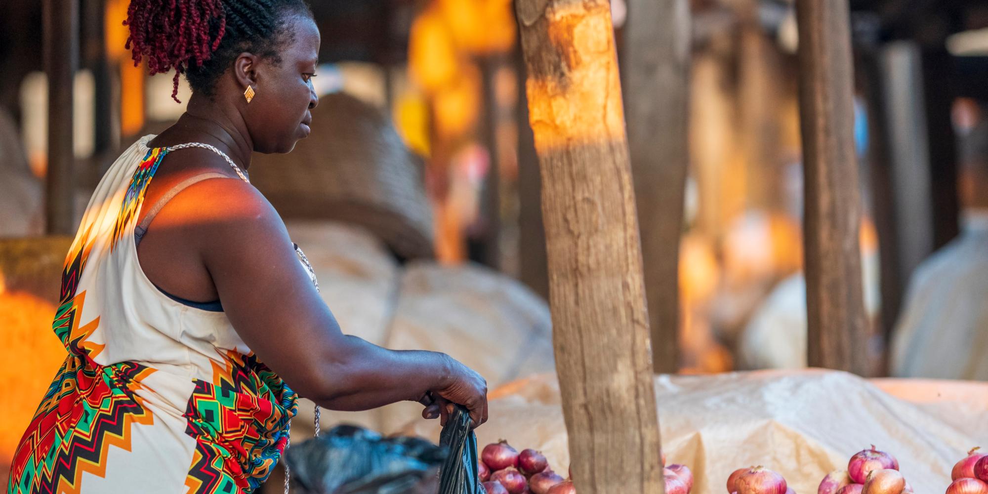 Ghanian woman working at her market stall