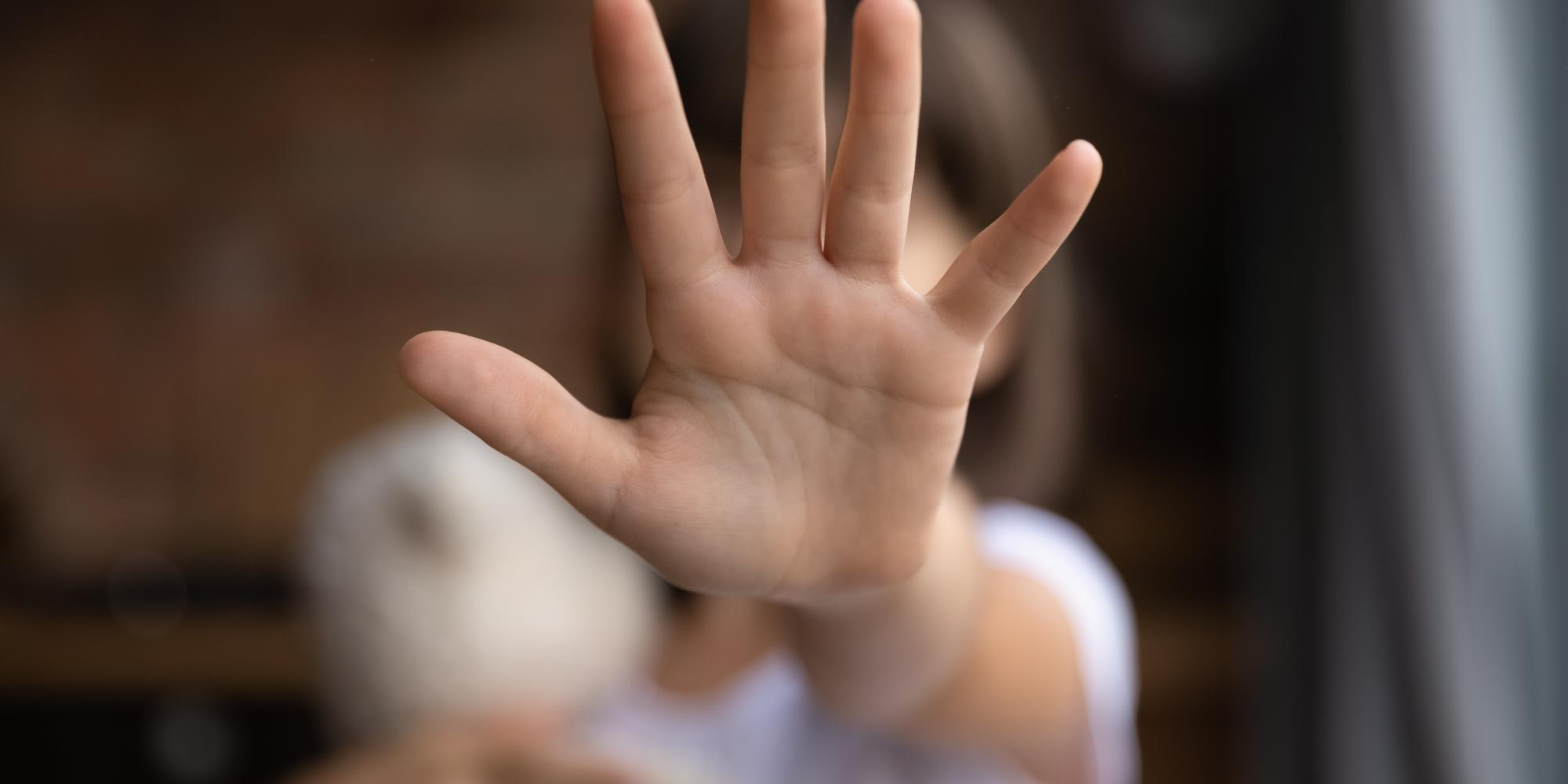 image of a child's outstretched hand