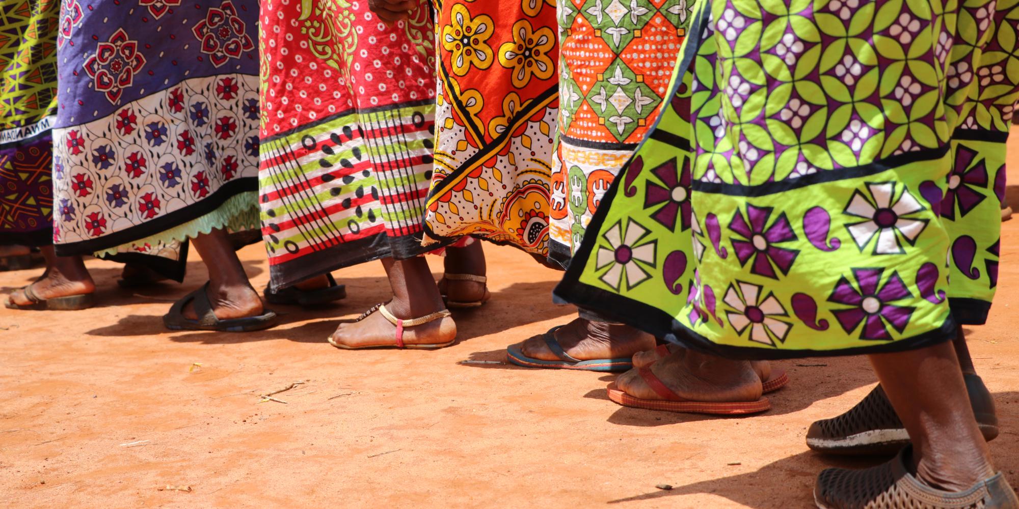 African woman walking in sanadals
